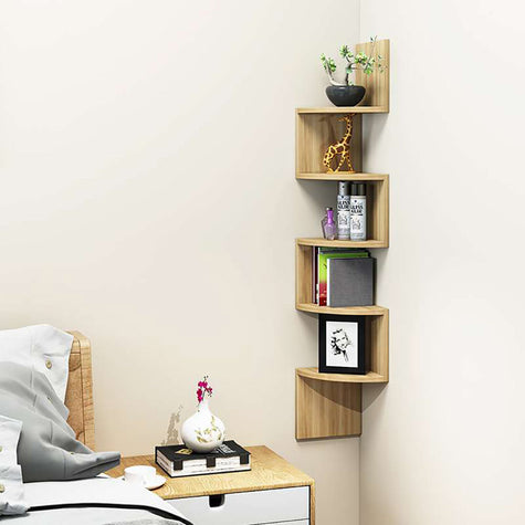 Five-tier rotating ladder-style corner shelves fixed in the bedroom corner, holding accessories and books, space-saving and decorative