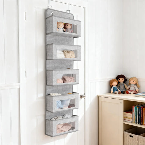 Multi-layer over-the-door hanging organizer filled with clothes and stuffed toys, a space-saving storage solution