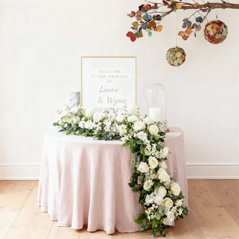 Woven basket with artificial flower bouquet in yellow, purple, and blue, held by person, UK home decor.