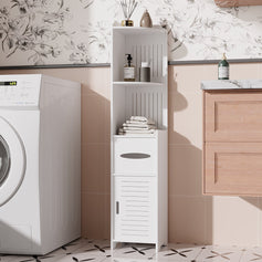 Three black corner caddy shelves mounted in the bathroom corner holding toiletries, with bath poufs and brushes hanging on the edges, neat and practical